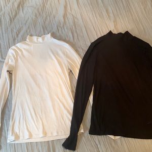 TWO fitted/ ribbed turtle necks (black and white). Women’s medium.